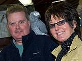 Dave Bloomfield with Julie Evans of Rochdale Development Agency and Smokey the talking parrot