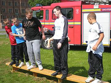 Team 3 trying to balance whilst passing water