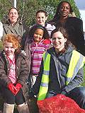 Children and staff from the Dream Scheme get ready to plant bulbs in Darnhill with Michelle Brodie (front) from Rochdale Borough Council.