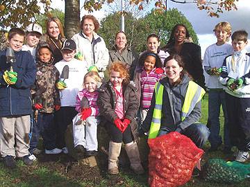 Children and staff from the Dream Scheme get ready to plant bulbs in Darnhill with Michelle Brodie (front) from Rochdale Borough Council.