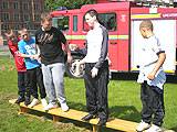 Team Eight trying to balance whilst passing water, one of the active workshops at the U-nite Event