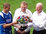 Oldham captain Chris Swailes is presented with the Rose Bowl by Rochdale Chairman Chris Dunphy and Oldham Chairman Barry Chaytow