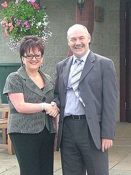 Motorstore manager Shirley Thorp & Hospice fundraising manager Ian Jenkins