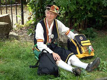 One of the dancers takes a break outside St Barnabas Church, Shore