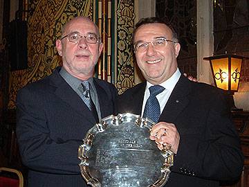 Ken Davies (right) receives the 'Man of Rochdale' award in 2006.