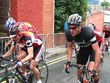 Cyclists reach the top of the steep climb up Penn Street