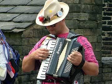 One of the Rochdale Morris musicians pipes up a tune on the accordian