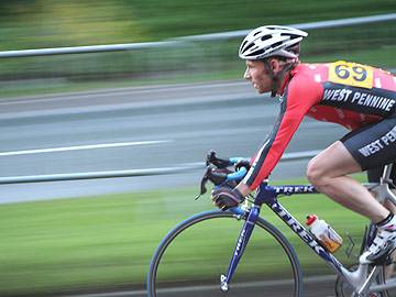 One of the elite race riders speeds down St Mary's Gate