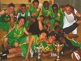 A Proud Basketball Team show off their trophies