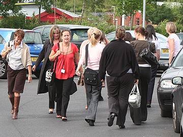 Dejected staff leaving work at MyTravel