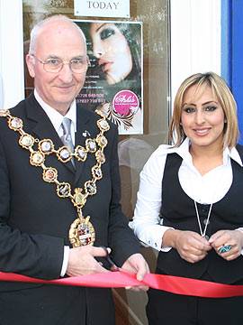 Cutting the ribbon: Rochdale Mayor, Councillor Peter Evans with 'Ashi's' owner Asma Akhtar