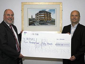 Rochdale Online Director John Kay hands a cheque to RDSFL Chairman Jim Matthews