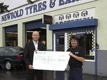 Newbold Tyres owner Jim Brogan hands a cheque to RDSFL Chairman Jim Matthews