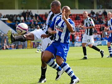 Nathan D'Laryea gets a foot in front of Danny Cadamarteri