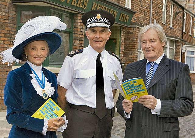 Chief Constable Peter Fahy, William Roache and the High Sheriff of Greater Manchester, Edith Conn launch the book giveaway on Coronation Street.