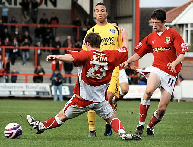 Paul McStay gets in a challenge on Joe Thompson, while the youngster gets to grips with Neil Wainwright.