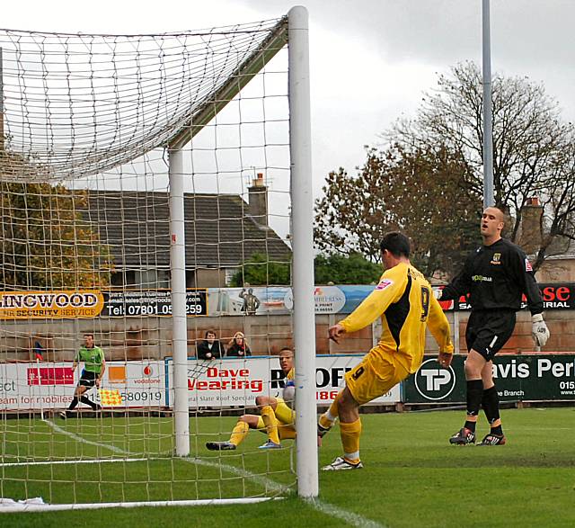 Dagnall can't miss as he snatches Thompson's goal away from him.