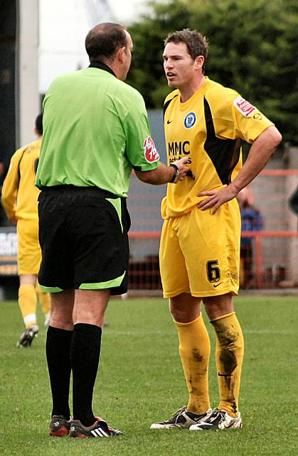 Toner gets a talking too from the referee.