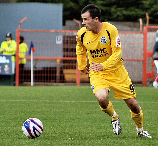 Dagnall drives Dale forward.