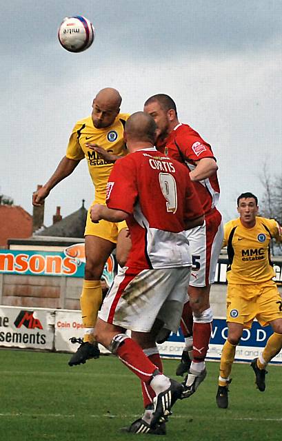 Thorpe wins the ball in the air.