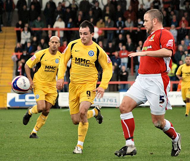 Dagnall comes up against Bentley.