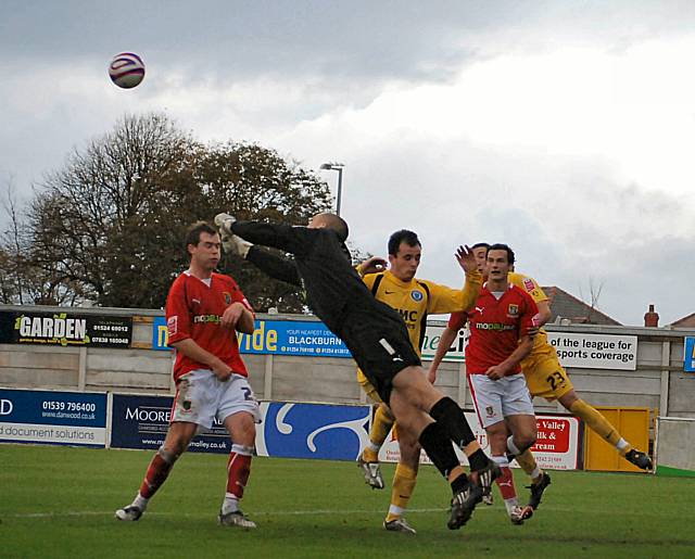 Barry Roche gets in a punch in front of Dagnall.