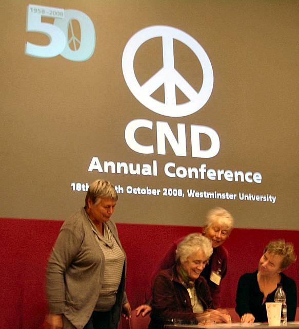 Peace Group members Mai Chatham, Pat Sanchez and Rae Street chatting with CND national chairman Kate Hudson on the platform at the conference on Sunday (19 October).