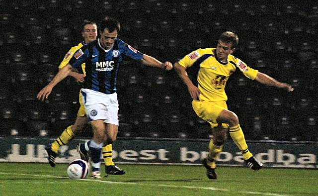 Chris Dagnall advances into the box before opening the scoring.