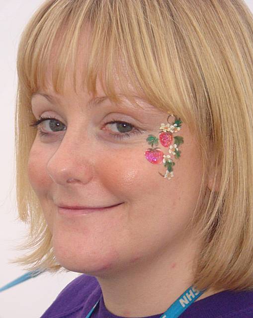 Health Trainer Michelle Duffy shows off her healthy face paint.