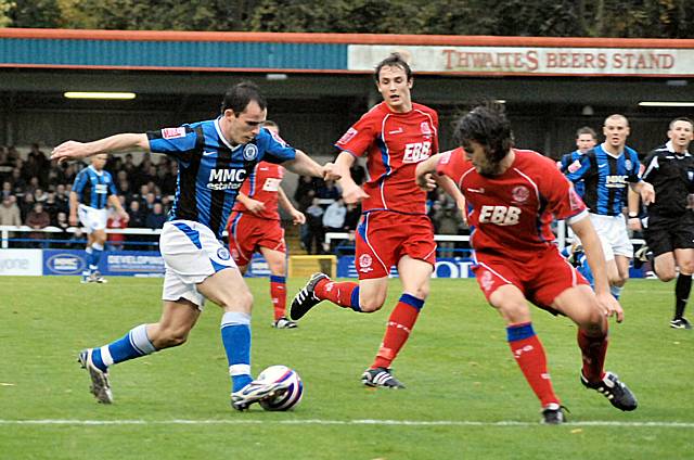 Dagnall attacks the Aldershot defence in the build up to Dale's opening goal.