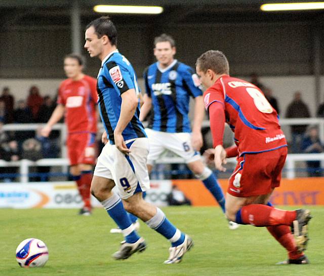 Dagnall gets away from Lewis Chalmers.