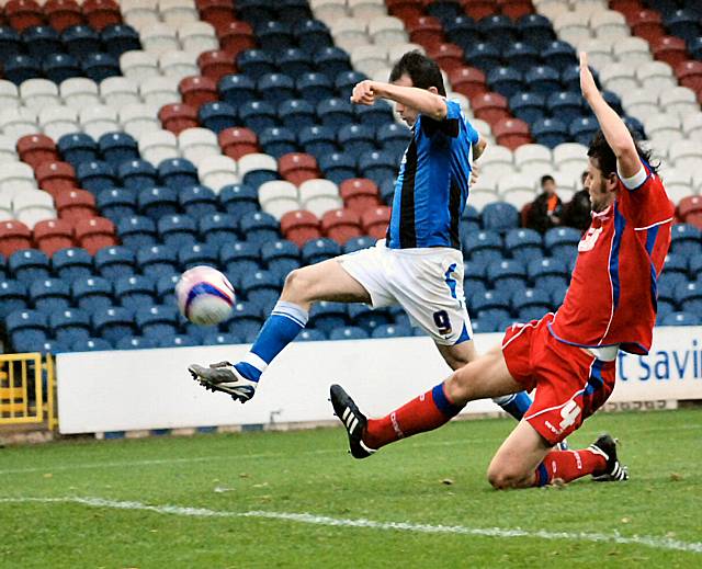 Dagnall contrived to put this chance over the cross bar from six yards out.