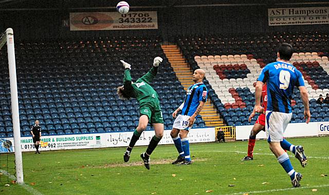 Dagnall sees another effort hit the bar as Bull tips his chip onto the woodwork.