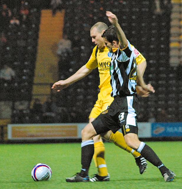 Gary Jones battles with Richard Butcher.