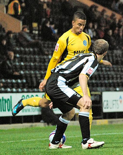 Joe Thompson puts in a cross in front of Clapham.