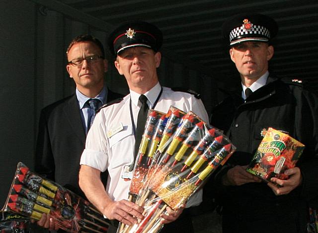 Graeme Levy, represententing the local Authority Trading Standards partners, Area Commander Russ James, from Greater Manchester Fire and Rescue Service and Chief  Superintendant Jon Rush, Greater Manchester Police with fireworks just before they were destroyed.