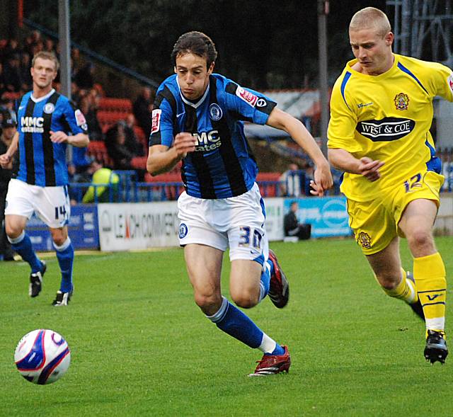 Will Buckley battles for the ball with Scott Griffiths.