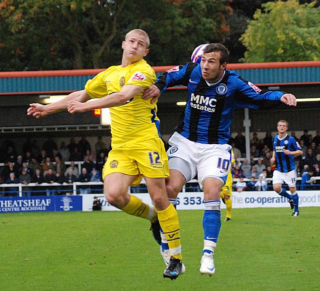 It's behind you! Le Fondre and Griffiths go up for a header.