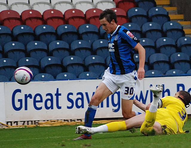 Arber puts in a tackle on Buckley.