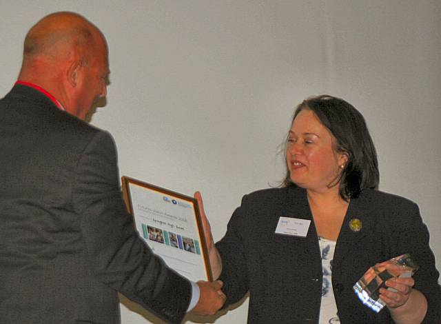 Springhill Head teacher, Annabel Bolt receives the school's Future Schools Award from Bob Harrison.