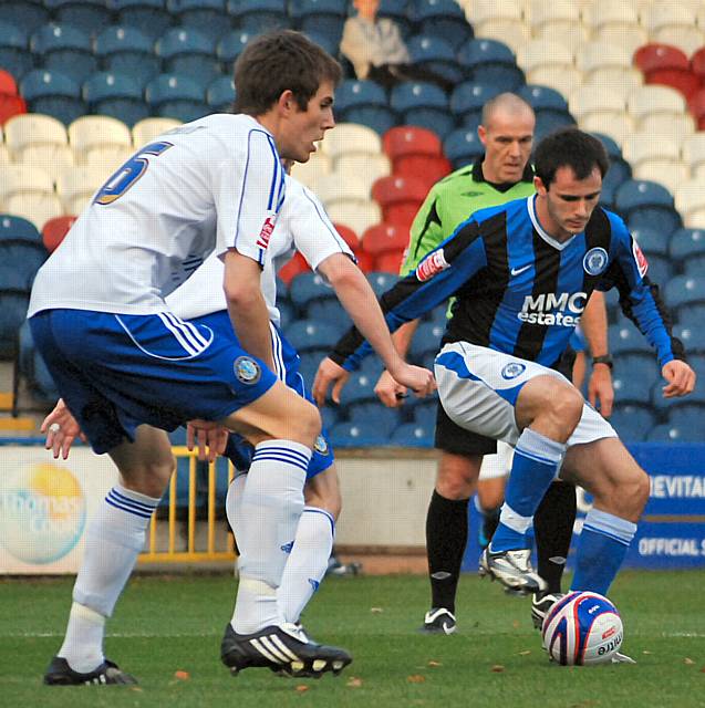 Chris Dagnall gets into the Macclesfield box.