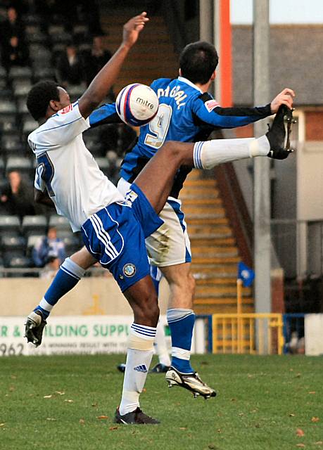 Brown and Dagnall challenge for the ball.