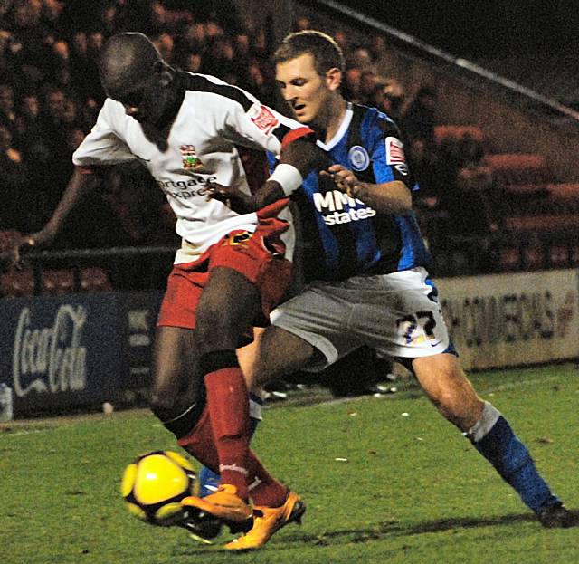 Luke Medley keeps the ball away from Mark Jones.