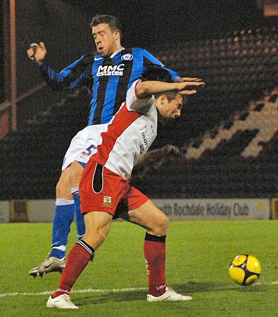 Clark Keltie and Michael Leary challenge for the ball.