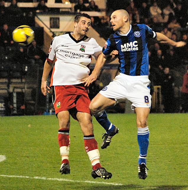 Gary Jones wins a challenge during the first period of extra time.