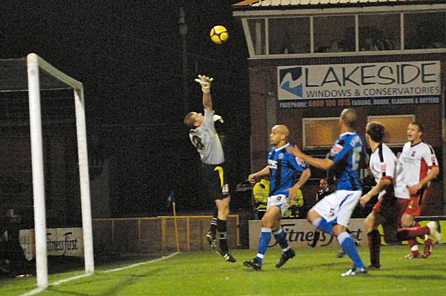 Le Fondre's wonderful chip loops over Harrison on its way to goal.