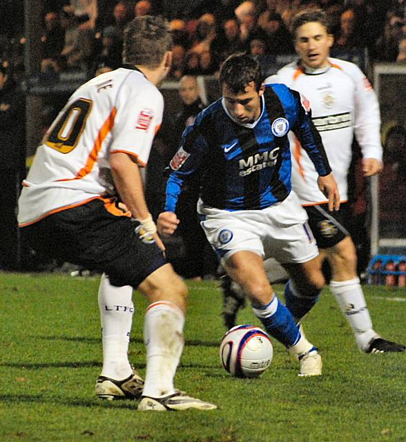 Le Fondre tries to get past Scott Spillane.