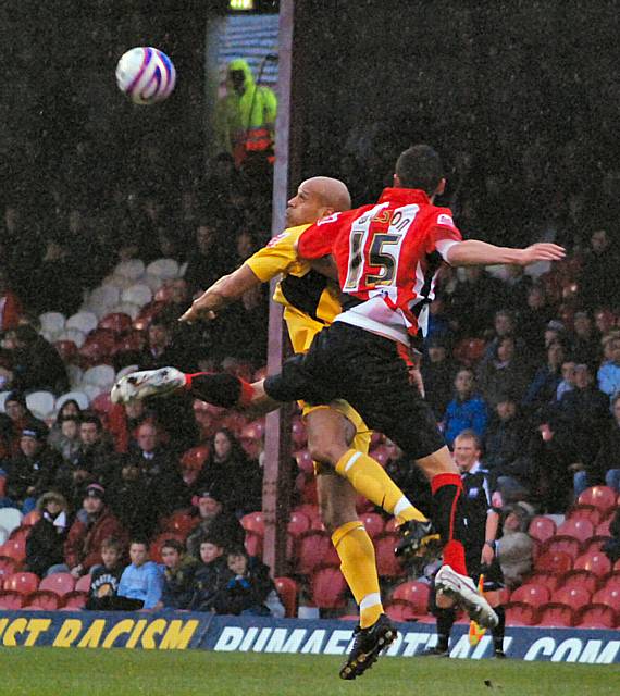 Thorpe chests the ball down ahead of James Wilson.