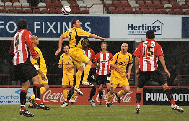 Ciaran Toner wins the ball in the air.