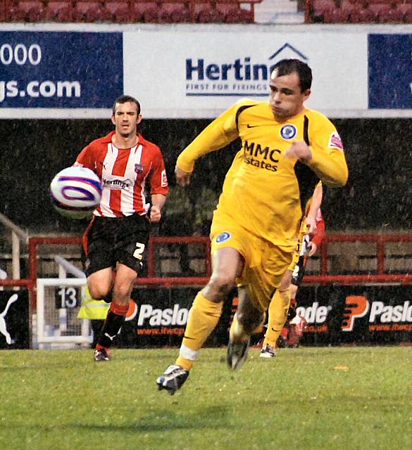 Dagnall chases the ball down.